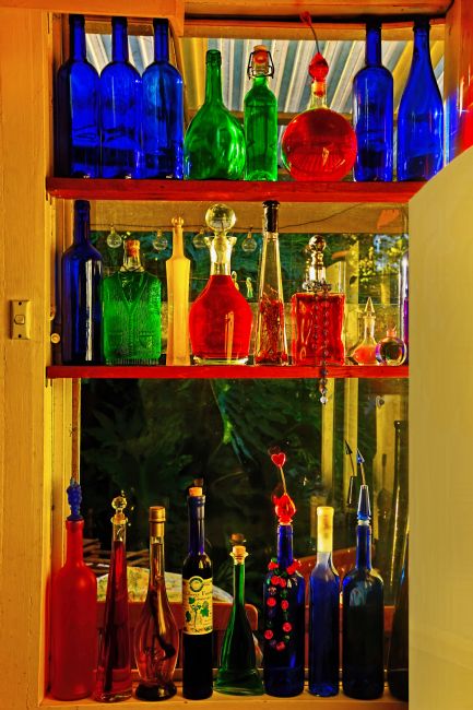 Kaye Menner | Window of Colorful Bottles
