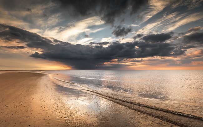 David Powley | Storm Clouds Over Brancaster Beach at Sunset