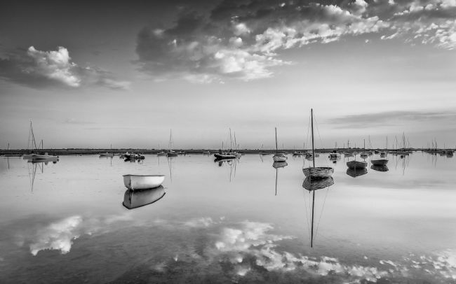 David Powley | Early Morning Reflections at Brancaster Staithe Monochrome