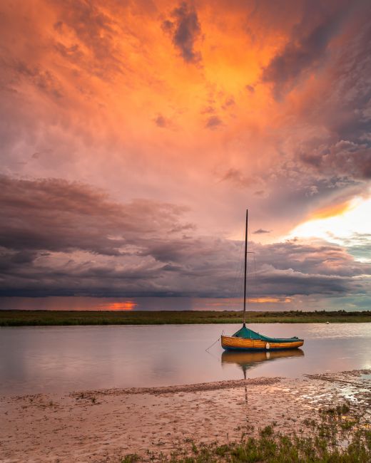 David Powley | Stormy sunset at Blakeney Harbour