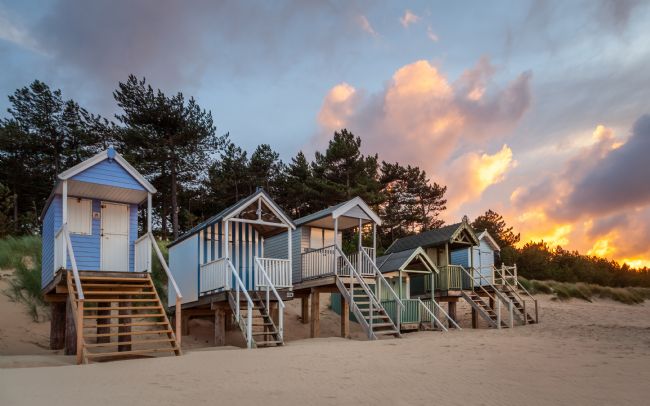 David Powley | Evening Light on the Beach Huts at Wells Norfolk