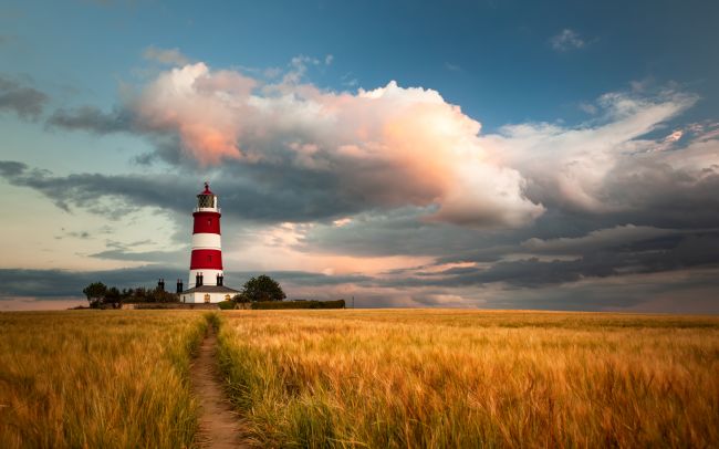 David Powley | Evening light over Happisburgh Lighthouse Norfolk