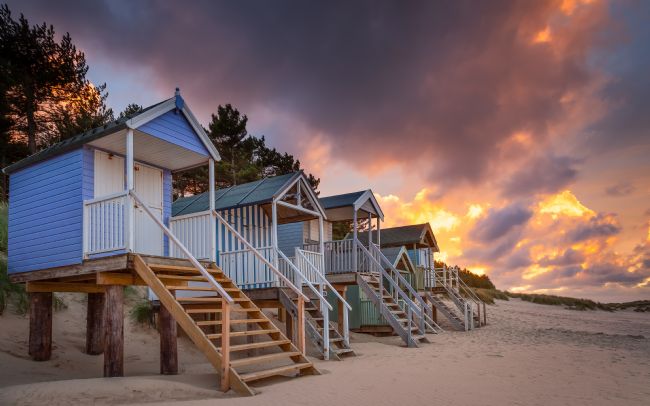 David Powley | Beach hut sunset at Well-next-the-sea