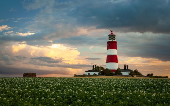 David Powley | Evening light over Happisburgh Lighthouse Norfolk